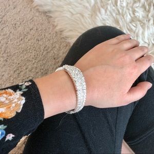 Silver bracelet and bunch of rings